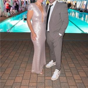 Size med has a stretch to it rose gold color sequin dress